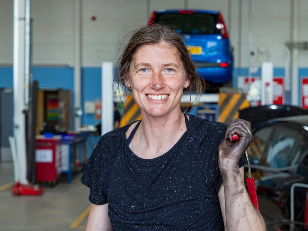mechanic holding a wrench